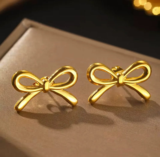 Pair of gold bow stud earrings in gift box