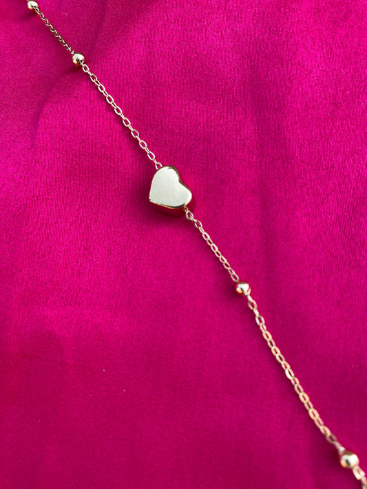 Gold bracelet with a heart-shaped