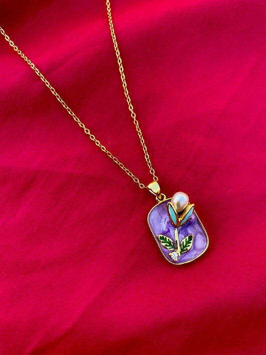 Modern Necklace with Pearl and Leaf Details on a Purple Background