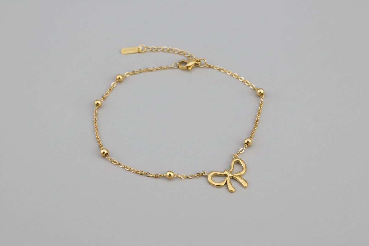 Gold bracelet with a bow charm (stainless steel)