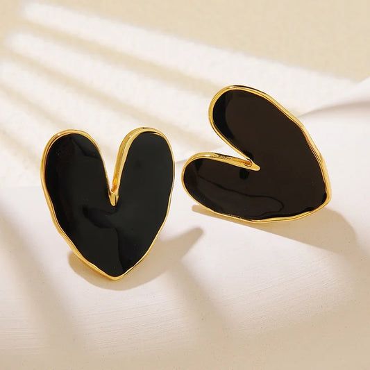 Black enamel heart stud earrings with gold border