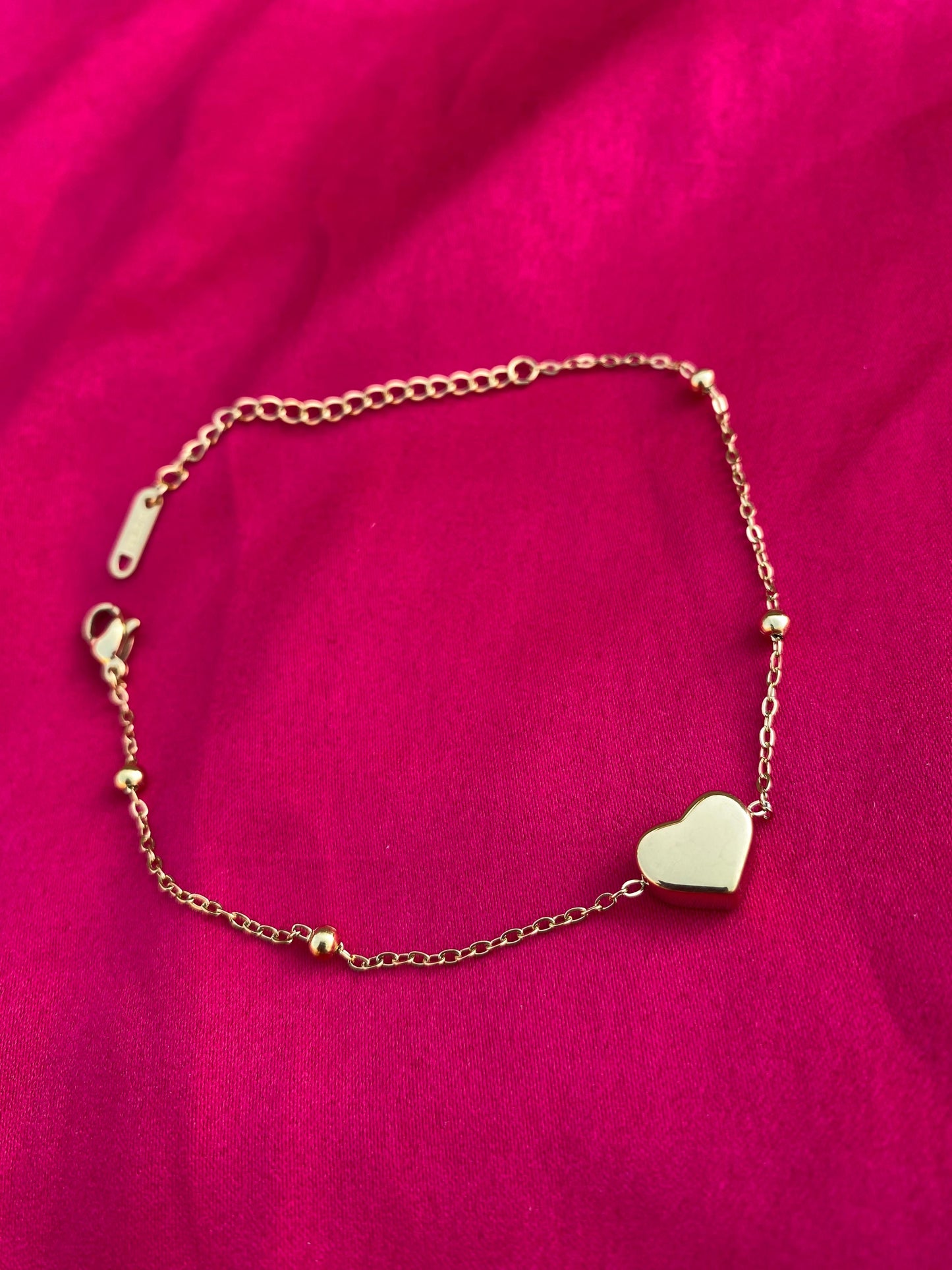 Gold bracelet with a heart-shaped