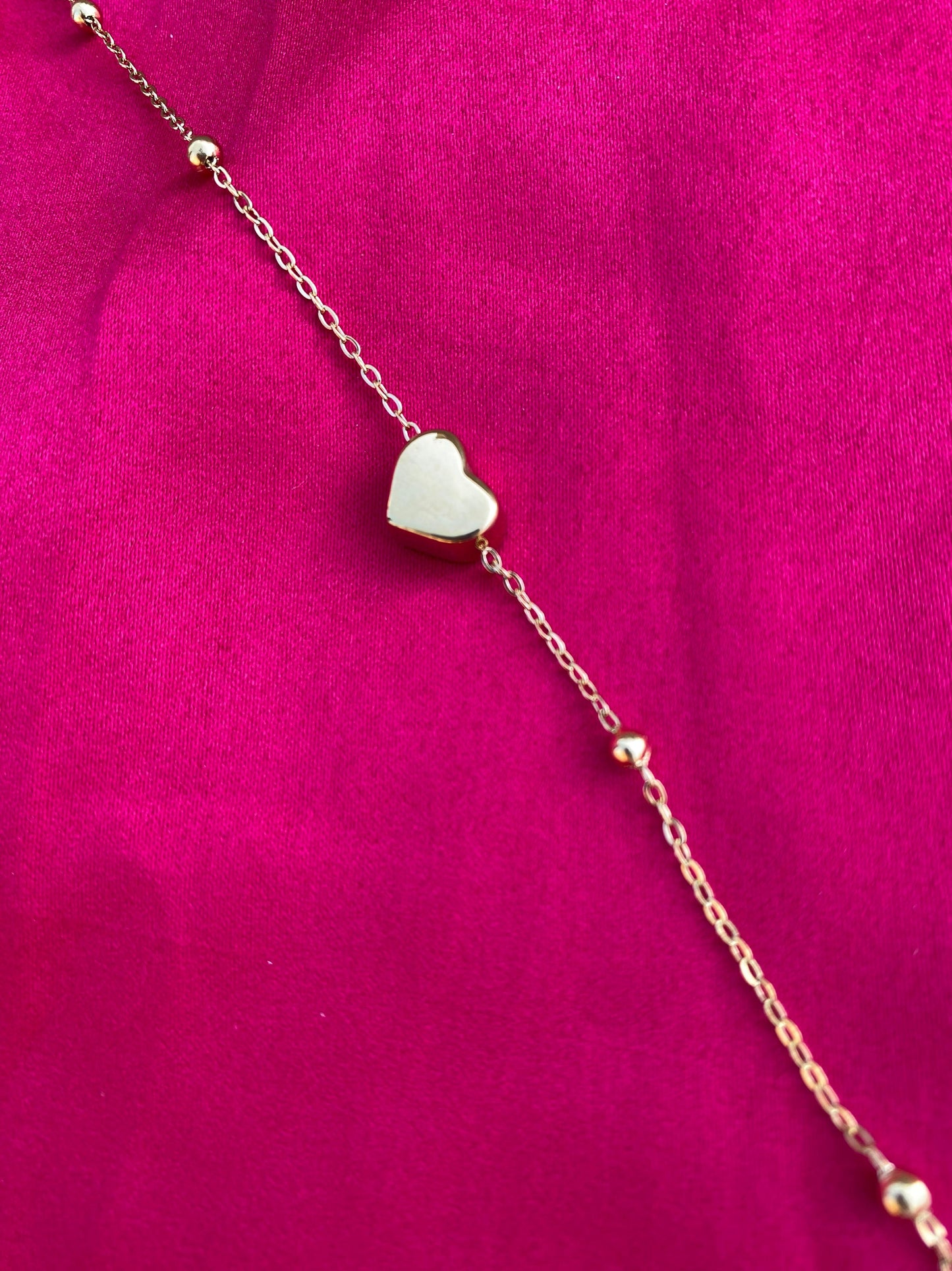 Gold bracelet with a heart-shaped
