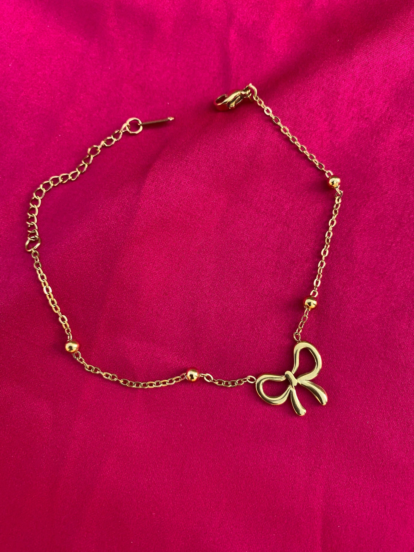Gold bracelet with a bow charm (stainless steel)