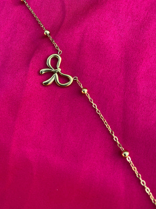 Gold bracelet with a bow charm (stainless steel)